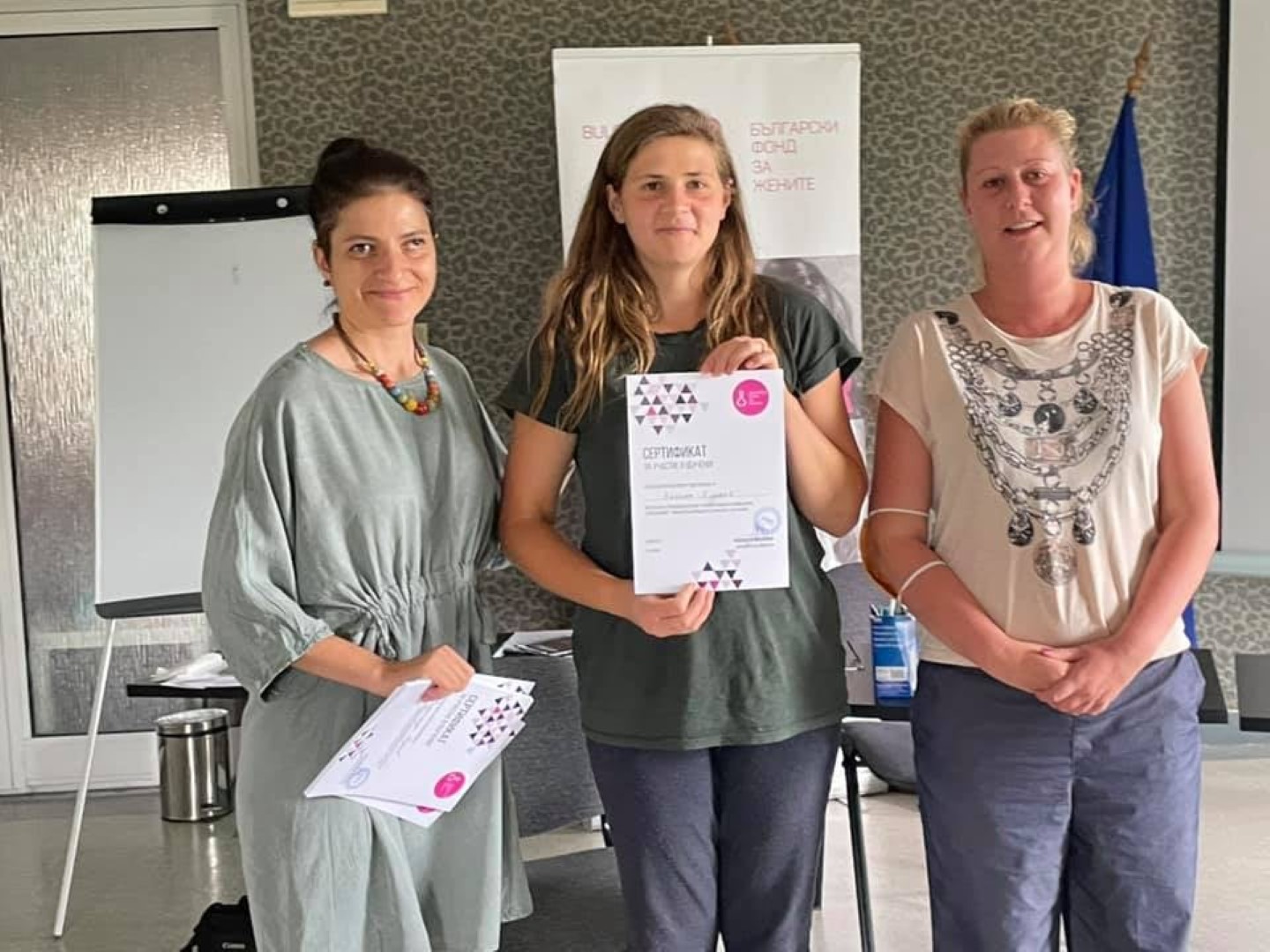 helena holding a certificate