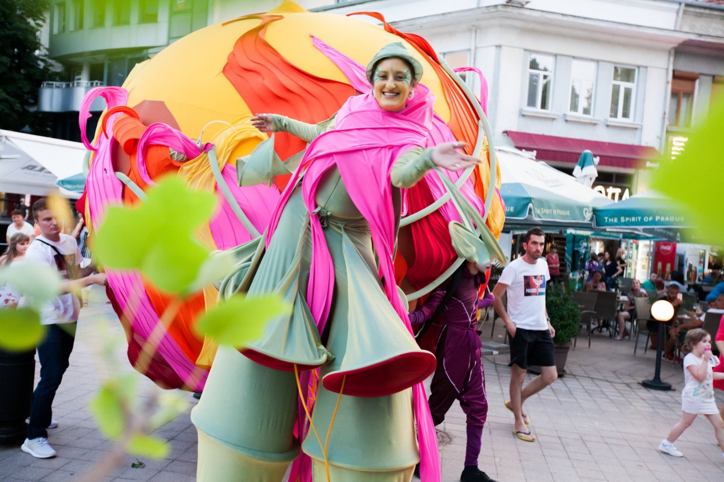 colourful performers on stilts