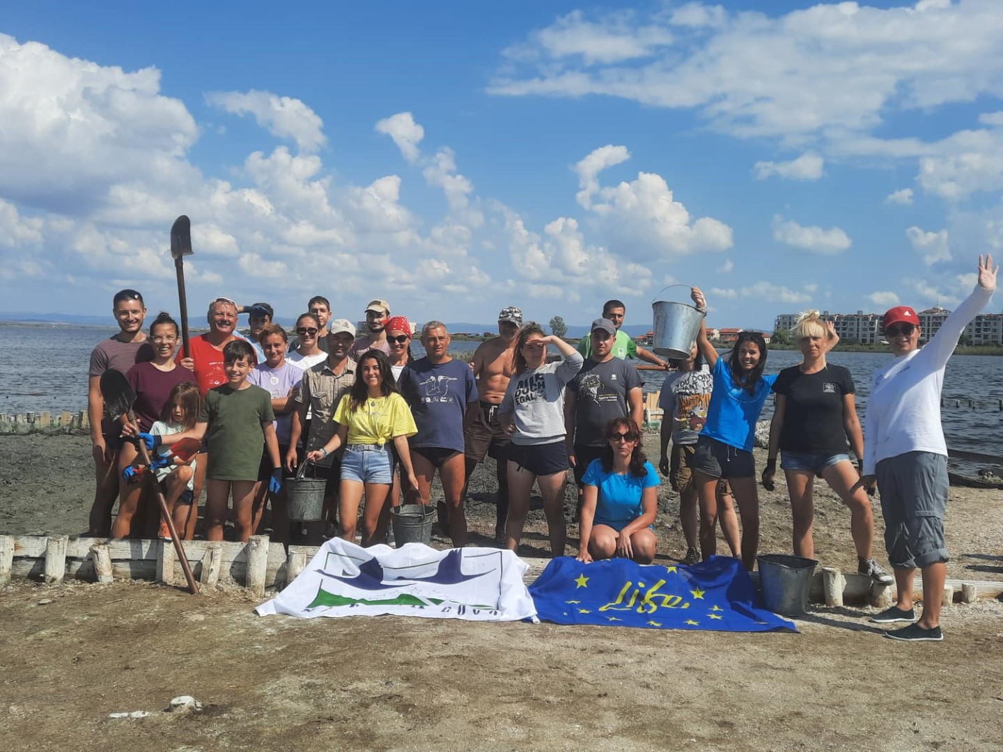 A group of volunteers with buckets