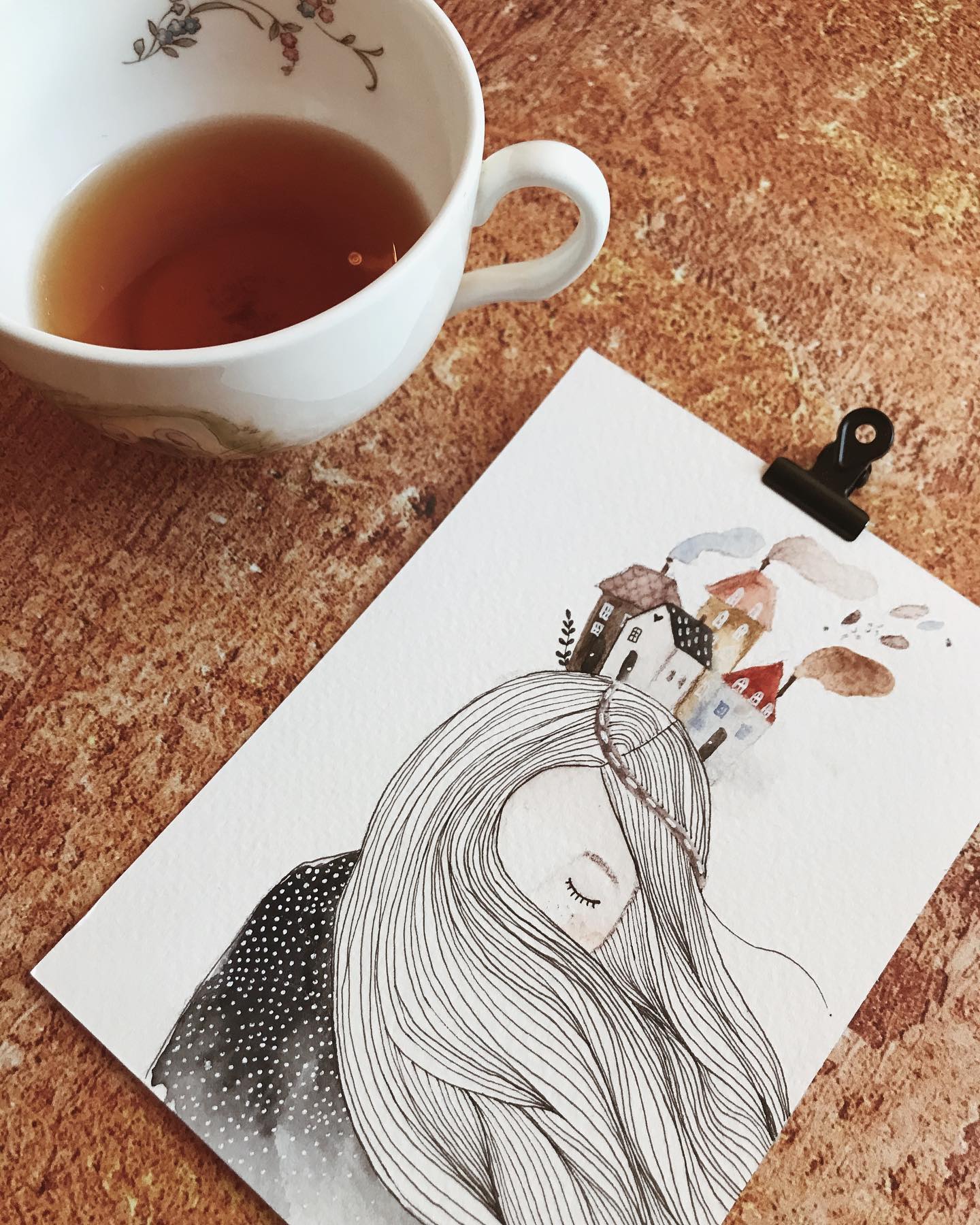 a drawing and a cup of coffee